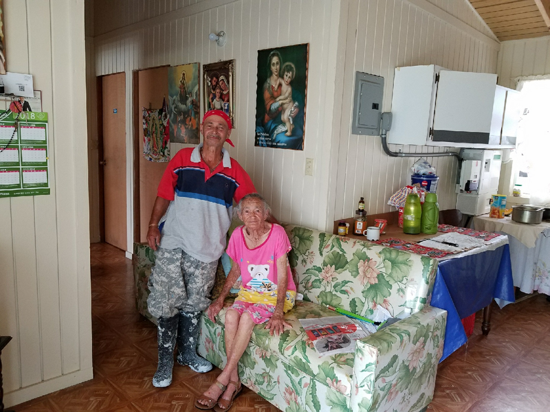 Martin Santana (left) and his mother, Martina Santana (right), in their home.